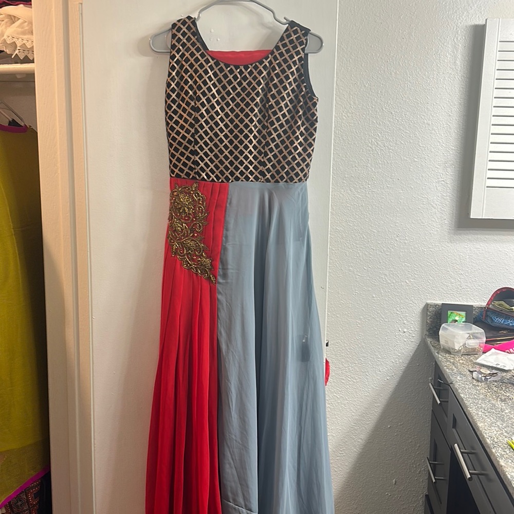 It’s Indian dress red and grey comes with black pant and scarf